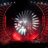 Remetendo a galáxia, Katy Perry surge voando no palco e cantando a música 'Witness' usando um figurino vermelho de pedras e óculos preto. O formato de olho no início do show remete ao visual do álbum da cantora