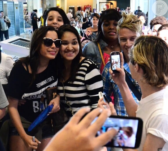 Anitta embarcou no aeroporto Santos Dumont, no Rio de Janeiro, nesta terça-feira, 22 de julho de 2014, e causou tumulto entre os fãs que estavam no local
