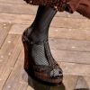 Os sapatos em alta no inverno 2019: sandália meia pata na passarela de Michael Kors