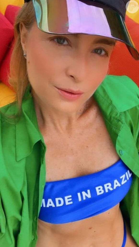 Angélica combinou top azul e blusa verde em homenagem ao Brasil