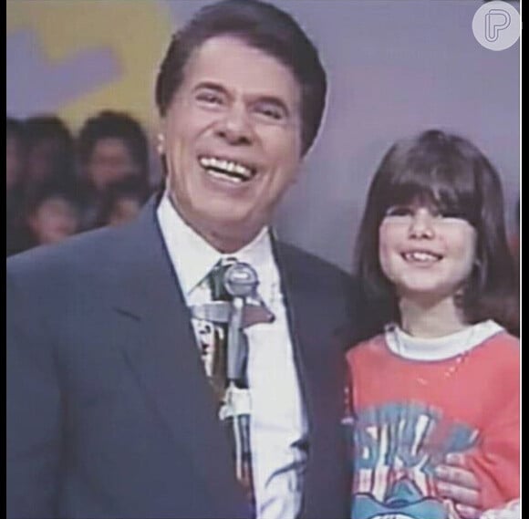 Silvio Santos com a filha caçula, Renata Abravanel, ainda criança durante gravação do programa 'Topa Tudo por Dinheiro'