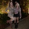 As irmãs Tati e Ana Paula Minerato usaram looks sexy, com decote, barriga e pernas à mostra, em festa junina da Ong Florescer