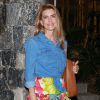 Maitê Proença usou saia midi floral com babados, camisa jeans e botas de camurça de salto no arraial de Luciano Huck e Angélica na casa do casal, neste domingo, 3 de julho de 2016