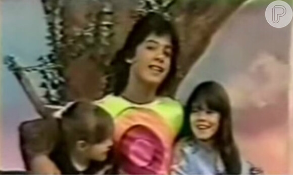 O grupo se tornou onipresente na TV brasileira. Na foto, Ray Reyes aparece no programa infantil, 'Balão Mágico', exibido pela TV Globo, ao lado de Symoni e Luciana