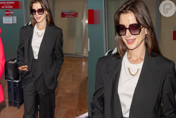 Anne Hathaway desembarcou com look preto e branco em Cannes