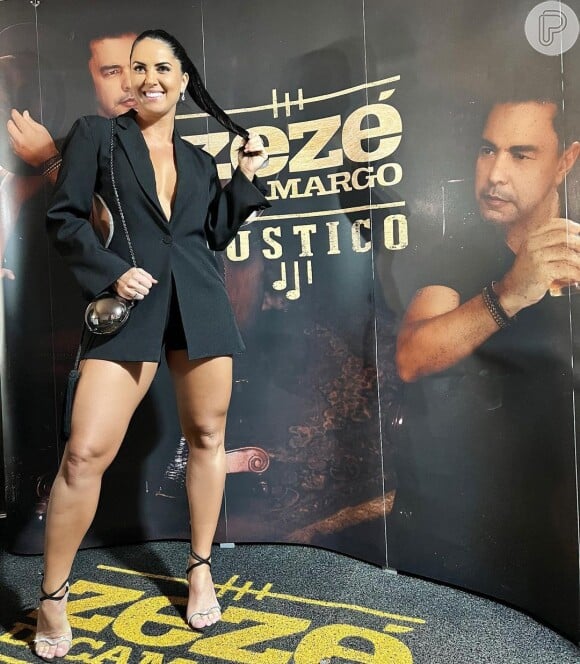 Graciele Lacerda marcou presença no show de Zezé Di Camargo em um look preto com decote profundo