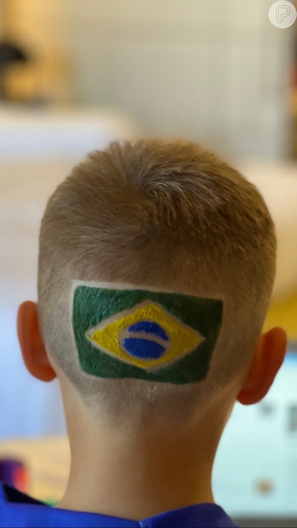 Filho de Neymar pintou a bandeira do Brasil na nuca e oresultado foi exibido pela mãe, Carol Dantas