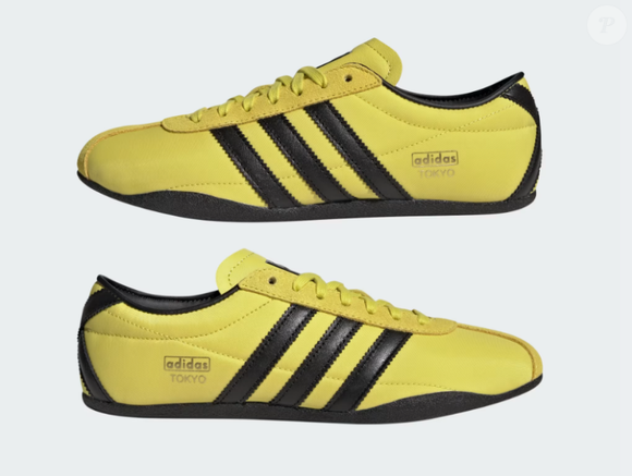 Tênis Adidas Tokyo na cor dourado com marrom possui cabedal leve, forma normal e fechamento em cadarço na mesma tonalidade do sapato.