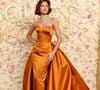 No Globo de Ouro 2025, Zendaya usou vestido laranja metálico além de acessórios da maison romana Bvlgari.