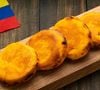 Muito além dos gramados, a Colômbia também inspira através da gastronomia. As famosas arepas, discos de massa de milho consumidos diariamente no país, serviram de referência para uma tonalidade que remete ao calor, à tradição e à riqueza cultural colombiana