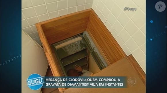 Mansão de milhões de Clodovil tinha passagens secretas - na foto da TV, Gugu Liberato sai da abertura escondida em uma espécie de cama