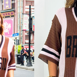Em alguns cliques, Paolla Oliveira aparece usando uma camisa de tricô listrada em tons de marrom e rosa, com a palavra “Brasil” estampada. Um modelo bem similar foi encontrado na loja Bella Chita por cerca de R$ 189,90