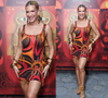 Lore Improta volta à Viradouro após nascimento do 2º filho com Léo Santana com vestido Emilio Pucci de US$ 1 mil, estampa vibrante e maxiargolas douradas