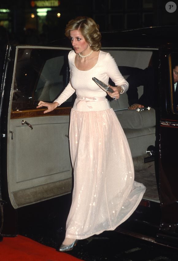 LONDON, ENGLAND - DECEMBER 05: Diana, Princess of Wales, wearing a floor length peach dress, arrives to attend a charity performance of Andrew Lloyd Webber's 'Starlight Express' at the Apollo Victoria theatre on December 5, 1984 in London, United Kingdom. (Photo by Anwar Hussein/Getty Images)