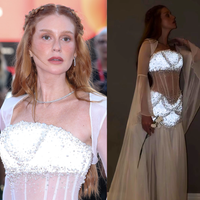 Bem-vinda de volta, Amália! Marina Ruy Barbosa revive ‘Deus Salve o Rei’ com vestido branco transparente, corset e 2.160 cristais que brilham em Veneza. Fotos!