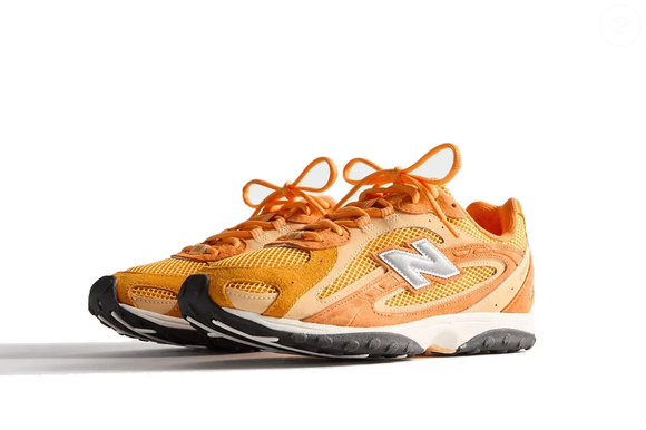 O New Balance 204L Kith Orange integra a linha 204L, que combina a tradição da marca com um design contemporâneo pensado para quem busca presença marcante no streetwear