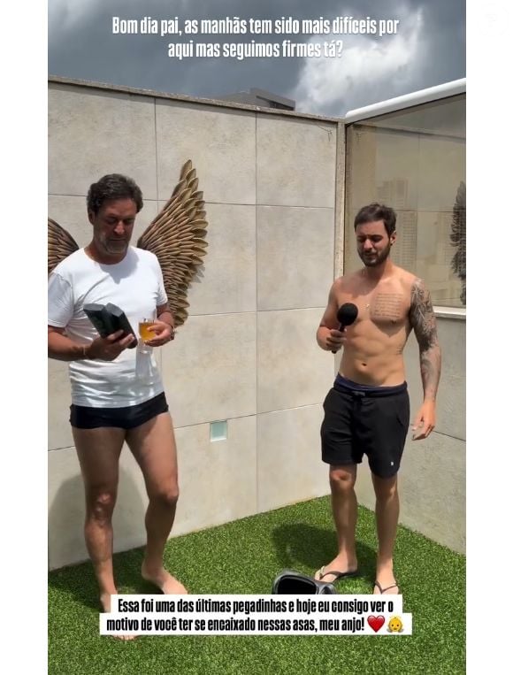 Filho de Henrique Maderite se emocionou ao ver que em vídeo pai se posiciona no meio de duas asas douradas presas na parede