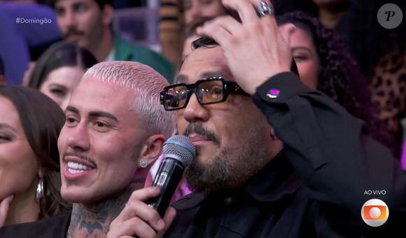 Belo bem que tentou desconversar, mas não conseguiu evitar o climão na TV