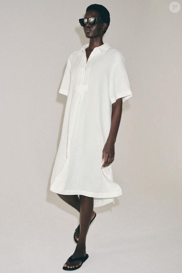 O vestido camisa branco de linho da Zara é uma opção para quem busca uma produção minimalista e sofisticada. Com mangas curtas, gola com lapela, botões frontais e modelagem soltinha, a peça está disponível por R$ 439,00