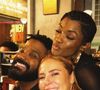 Paolla Oliveira não publicou fotos com o mestre de bateria da Grande Rio, mas posou ao lado de Erika Januza e Arlindinho