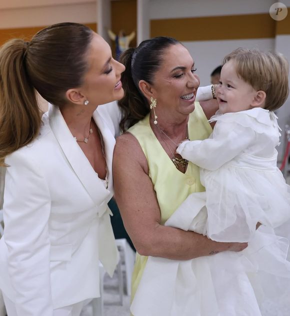 Filho de Zé Felipe e Virginia ganha colo da avó materna no batizado