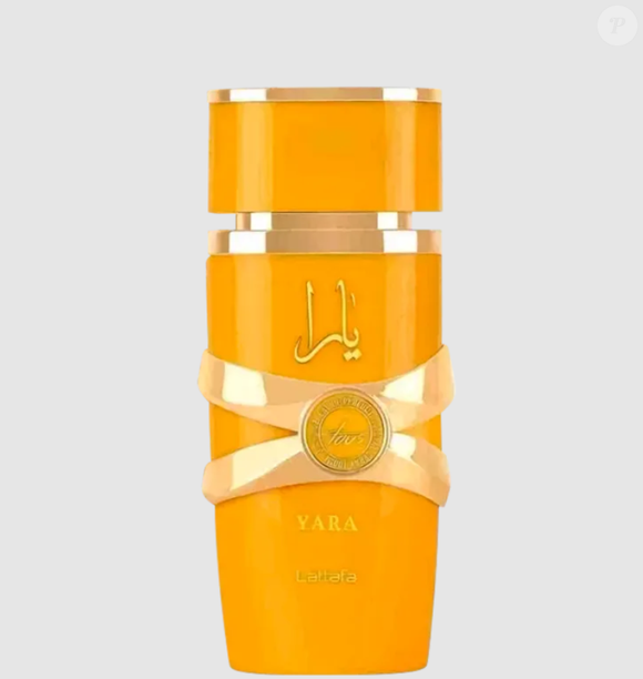 Perfume árabe Yara Tous 100mL, de Lattafa, traz uma embalagem amarela, com notas cítricas, florais e ambaradas.