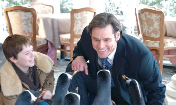 Jim Carrey já mostrava sinais de envelhecimento em 'Os Pinguins do Papai', outro grande sucesso nos cinemas