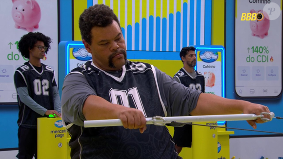 A Prova do Líder de resistência do Big Brother Brasil 26 acontece em duplas e exige coordenação constante: enquanto um participante mantém um botão pressionado, o outro sustenta uma barra que mantém um prato suspenso sem deixar um ímã tocar o chão