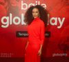 Vestido vermelho longo de mangas compridas e gola alta foi a escolha de Tais Araujo para a festa de lançamento das séries 'Vermelho Sangue' e 'Reencarne', produções de terror da Globoplay em 2 de outubro de 2025