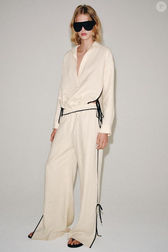 Para quem busca uma produção elegante sem abrir mão do conforto, a Calça com Debrum 100% Linho ZW Collection combina tecido natural, silhueta ampla e acabamento contrastante. Em tom bege, a peça ainda facilita combinações com diferentes cores e propostas para a nova estação. Preço: R$ 439