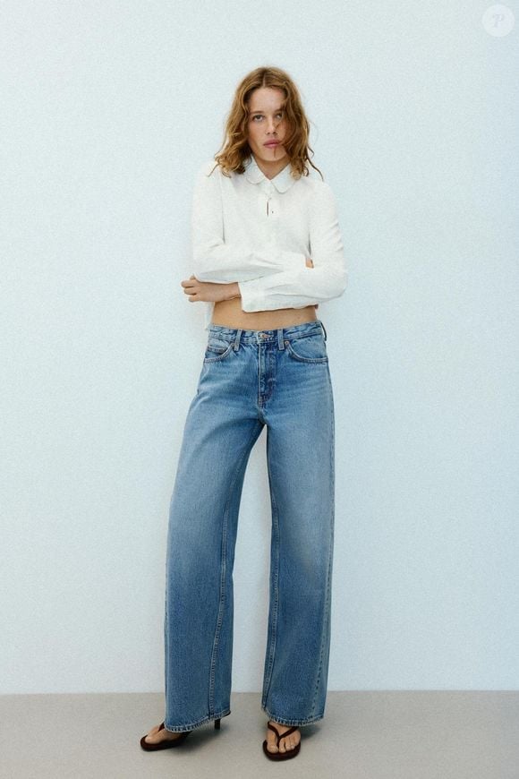 O Adidas Tokyo na cor creme de chantilly combina com jeans de corte reto e camisa estilo Oxford para criar um look casual e elegante. A calça da Zara, disponível por R$ 279,00, complementa a proposta com uma peça versátil para diferentes ocasiões