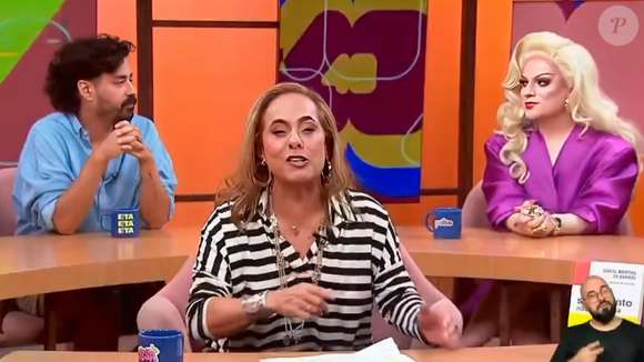 A drag queen Lorelay Fox e o comediante Fernando Pedrosa, ambos personalidades LGBTQIAPN+, trocam olhares que parecem de reprovação quando ouvem o nome de Claudia Leitte